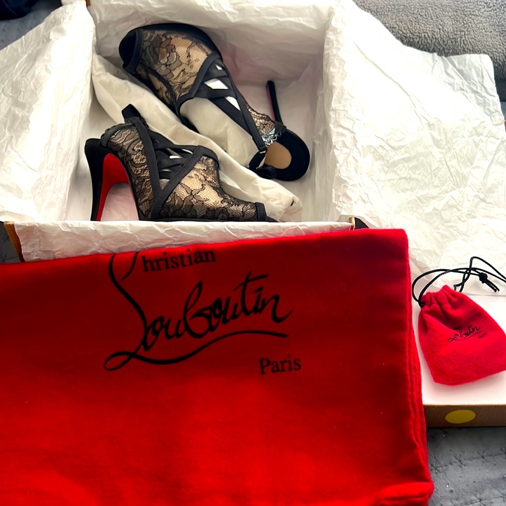 Christian Louboutin black lace heel.